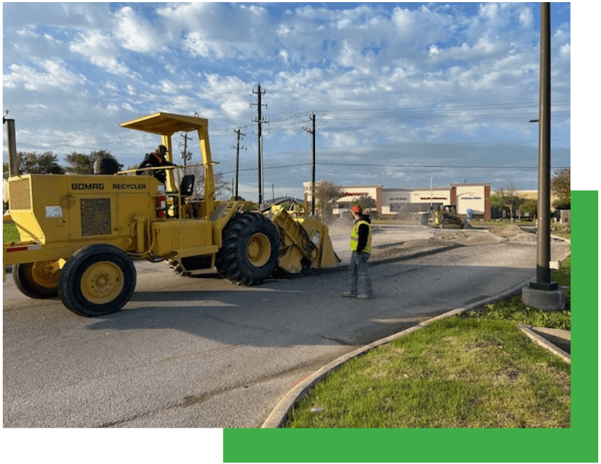 Reclaimer machine grinding and stabilizing pavement base in place