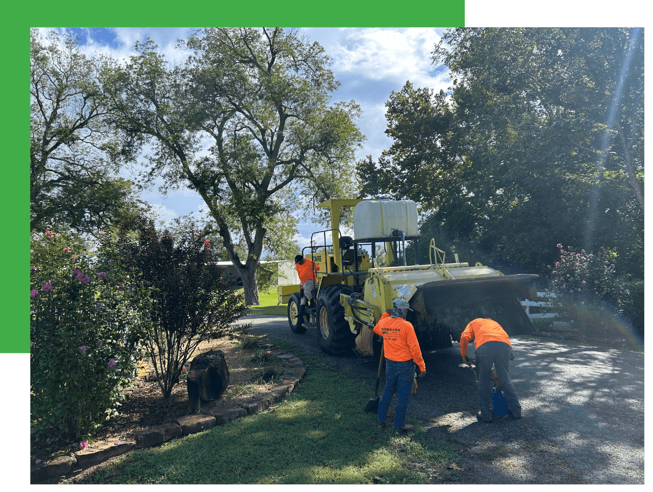 Asphalt overlay paving with a paver and crew